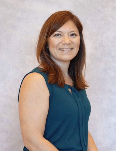 Jennifer Garren, APRN-C, smiling in a teal top, light background.