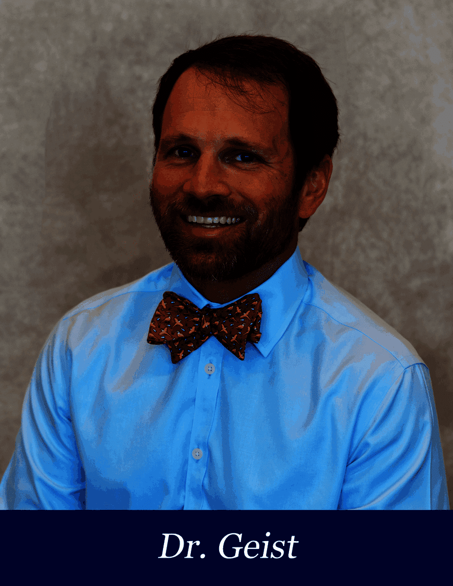 Dr. Geist smiling in a blue shirt with a red bow tie, available to help answer questions Monday through Thursday.